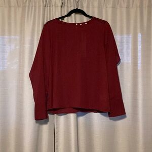Molly Bracken, maroon dress shirt in size medium.